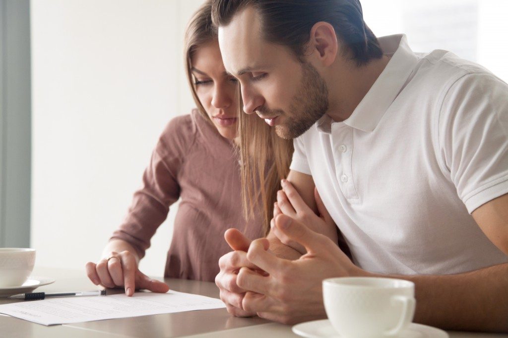 Couple studying a loan contract