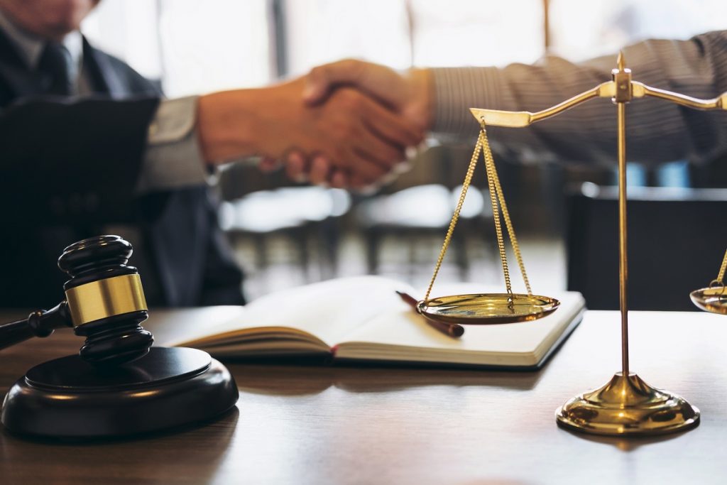 Attorney and client handshake